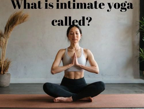 a woman doing yoga's seated crane pose in a studio