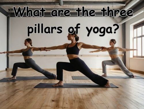 three women doing warrior yoga pose in a studio