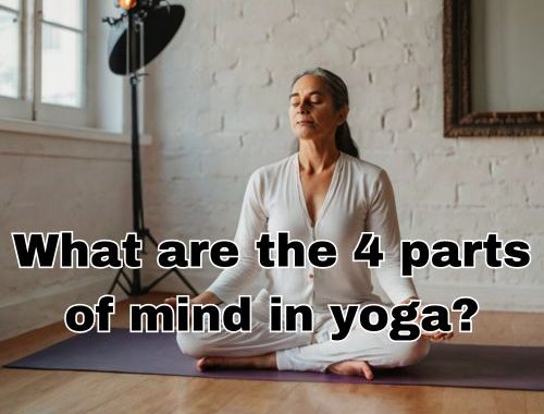 Studio light falls softly on Kriya Yoga pose.
