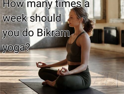 Calm woman balances in a Bikram yoga posture.