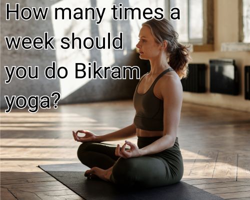 Calm woman balances in a Bikram yoga posture.