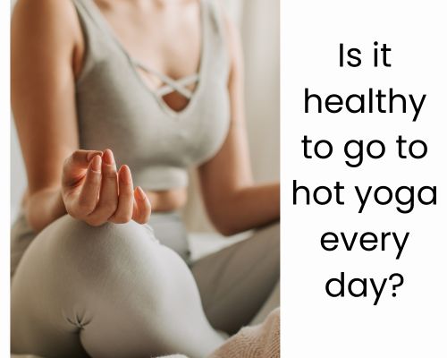 Woman holds steady balance in Bikram yoga routine.